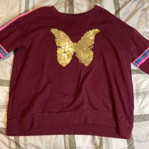 Size: Small. Maroon-ish sweater with gold butterfly sequins and colorful strips.